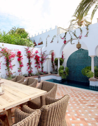 D3 Designed patio with dining area and pool in moorish style with water cascade